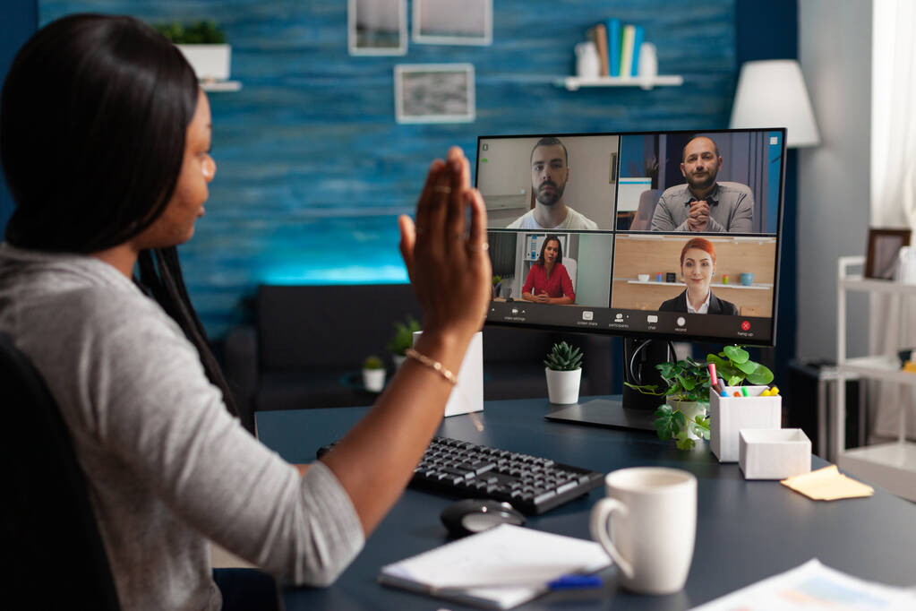African american overworked woman greeting school collegue during online webinar videocall